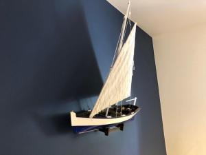 a model of a boat hanging on a wall at Villa Julius Sopot in Sopot