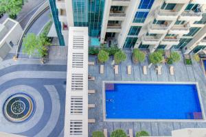 an overhead view of a swimming pool in a building at Durrani Homes - Luxurious Studio near Dubai Mall with pool view in Dubai