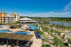 a resort with several swimming pools and a river at Ilhas do Lago Eco Resort in Caldas Novas