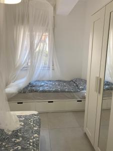Postel nebo postele na pokoji v ubytování Casa Aletos Roccalumera-Taormina