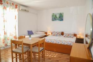 Posteľ alebo postele v izbe v ubytovaní Apartments Butkovic