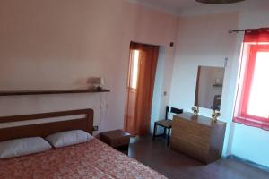 A bed or beds in a room at PANORAMIKA