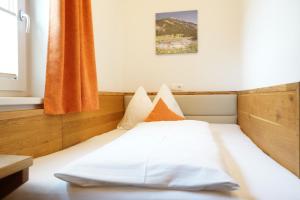 Ein Bett oder Betten in einem Zimmer der Unterkunft Bergfink apartments