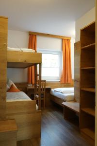 Ein Bett oder Betten in einem Zimmer der Unterkunft Bergfink apartments
