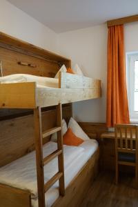 Ein Bett oder Betten in einem Zimmer der Unterkunft Bergfink apartments