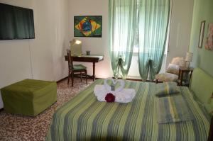 Postel nebo postele na pokoji v ubytování B&B Villa Olmo
