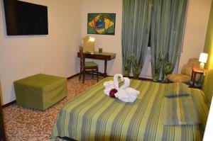 Postel nebo postele na pokoji v ubytování B&B Villa Olmo