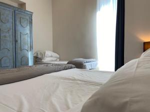 Postel nebo postele na pokoji v ubytování Jazz Hotel