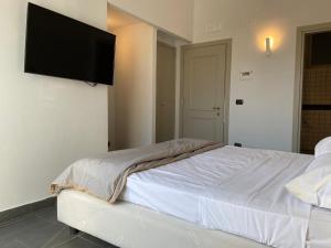 Postel nebo postele na pokoji v ubytování Jazz Hotel