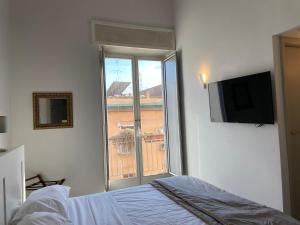 Postel nebo postele na pokoji v ubytování Jazz Hotel