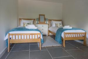 A bed or beds in a room at Hayloft