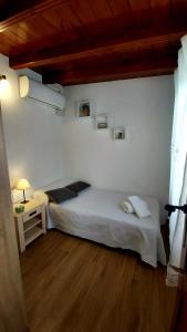 Łóżko lub łóżka w pokoju w obiekcie Casa Rural La Resbala - Casa Tajinaste