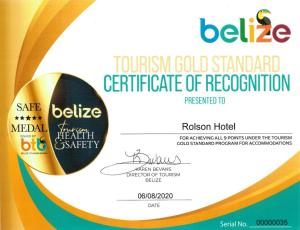 a yellow gold standard certificate of recitution at Rolson Hotel in San Ignacio