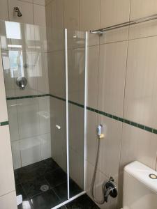 Um banheiro em Vila Stellino Suítes