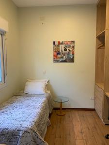 Cama ou camas em um quarto em Vila Stellino Suítes
