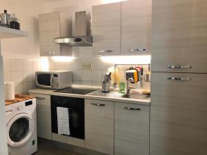 a kitchen with a sink and a microwave at House Trevi in Rome