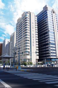 
a city street with tall buildings and tall buildings at Al Diar Dana Hotel in Abu Dhabi
