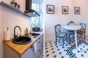Kuchyňa alebo kuchynka v ubytovaní Apartamenty Rejtana