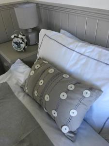 a pillow sitting on top of a bed at Ballyginniff Farm House in Crumlin