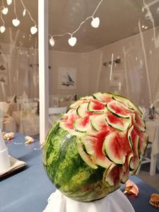 a watermelon sitting on a table in a store at Hotel Villa Rosa in Sestri Levante