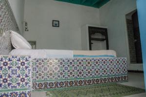 Кровать или кровати в номере Hôtel Djerba Erriadh