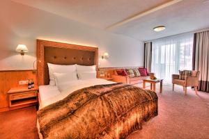 Voodi või voodid majutusasutuse Hotel Garni Urezza toas