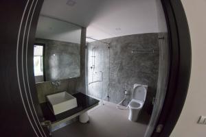 A bathroom at The Elegance Pool Villas