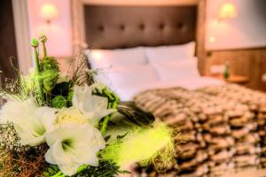 Voodi või voodid majutusasutuse Hotel Garni Urezza toas