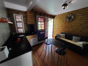 a living room with a couch and a table at Le Bon Refuge in Le Lamentin
