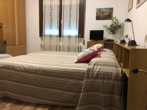 Postel nebo postele na pokoji v ubytování Alloggi Al Giardino & La Suite
