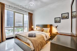 Postel nebo postele na pokoji v ubytování Al Majara by EMAAR, Dubai Marina