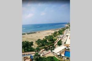an aerial view of a beach and the ocean at Villa Marina Benalmadena - 5 min walk to the beach, heated pool, spa, 5 bedrooms in Benalmádena