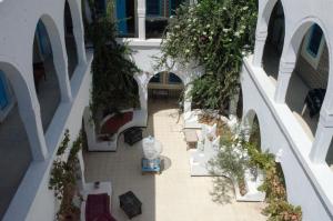 an overhead view of a mall with tables and trees at Hôtel Djerba Erriadh in Houmt Souk