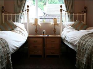 Ліжко або ліжка в номері King William IV Guest House