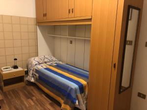 Postel nebo postele na pokoji v ubytování Alloggi Al Giardino & La Suite
