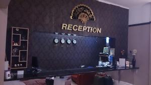 a store with a reception sign on a wall at Hyde Park Court Hotel in London