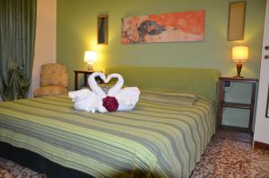 Postel nebo postele na pokoji v ubytování B&B Villa Olmo