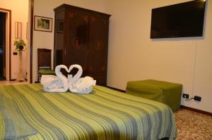 Postel nebo postele na pokoji v ubytování B&B Villa Olmo