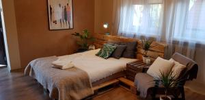 Postel nebo postele na pokoji v ubytování Apartament delux z tarasem
