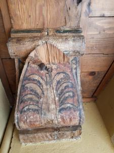 a piece of wood with an animal carved on it at AKANTHO apartment in Mantova