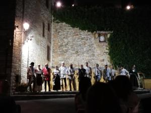 a group of people standing on a stage in a building at B&B Al Borgo in Corciano