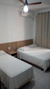 Cama o camas de una habitación en FICARE POA - 3min do Complexo Hospitalar Santa Casa