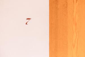 a kite sitting on top of a white wall at Hotel Ayook in Oaxaca City