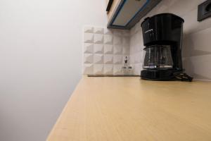 Kuchyň nebo kuchyňský kout v ubytování Orion Eco Suites