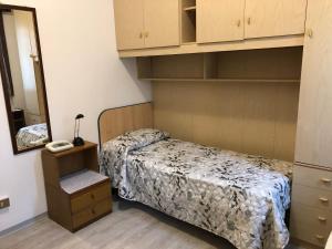 Postel nebo postele na pokoji v ubytování Alloggi Al Giardino & La Suite
