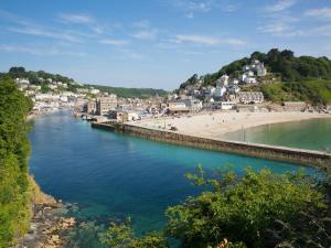 a view of a beach and a body of water at The Old Vicarage in Looe