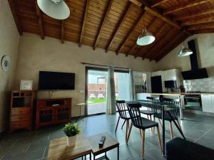 a kitchen and dining room with a table and chairs at LA ERA 2 in El Cotillo