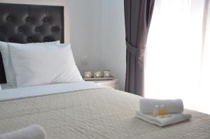 Postel nebo postele na pokoji v ubytování Andaluni Beach Apartments