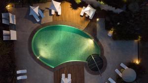 an overhead view of a swimming pool with a basketball at Donna Carmela Resort & Lodges in Riposto