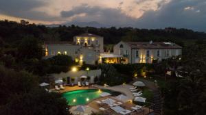 an aerial view of a house with a swimming pool at Donna Carmela Resort & Lodges in Riposto